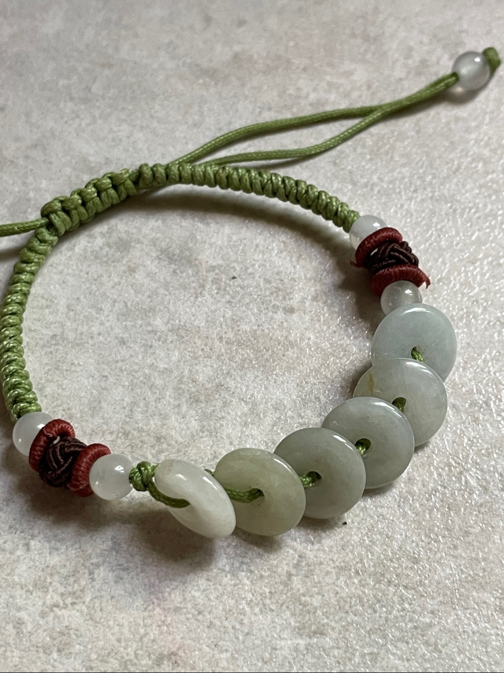 White jade adjustable lucky Chinese bracelet on green cord unisex